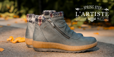 Spring Step boots sitting on sidewalk