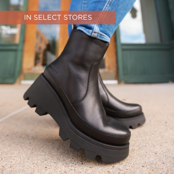 Woman lifting heel up to show shoe