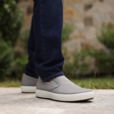 Man standing on sidewalk