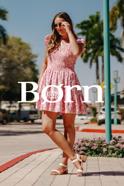 Woman standing on sidewalk posing