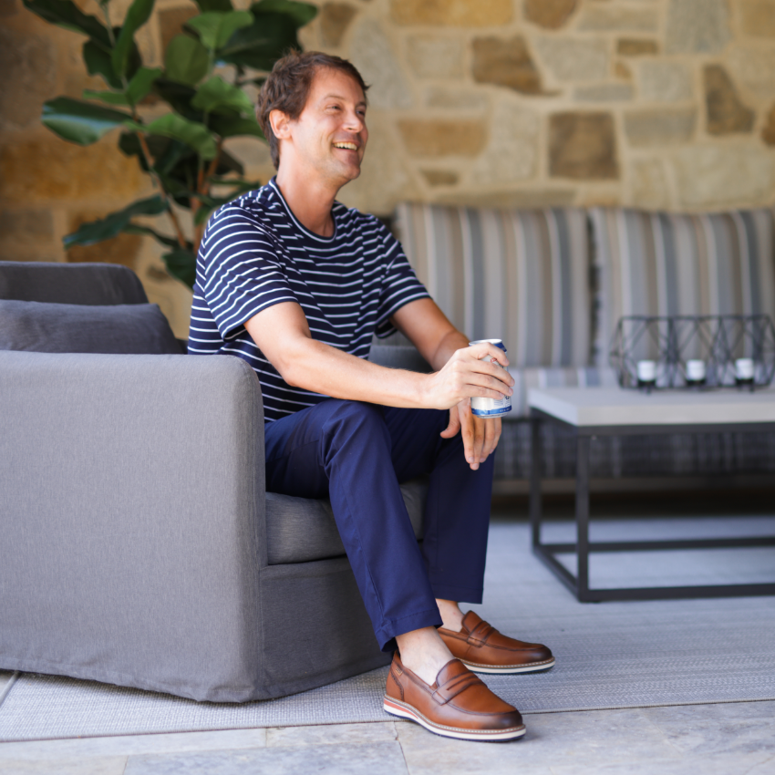 Man sitting in chair talking