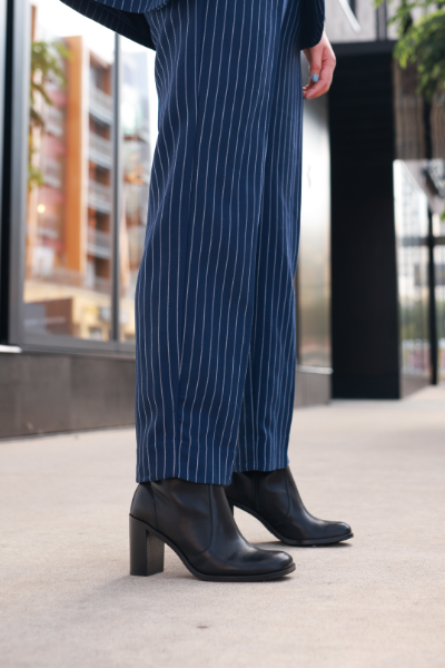 Woman standing on sidewalk