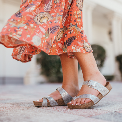 Woman standing on sidewalk