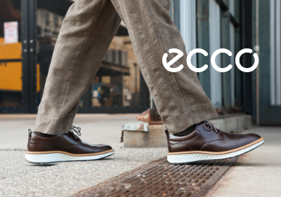 Man walking downtown in Ecco St.1 Hybrid Cap Toe derby shoe