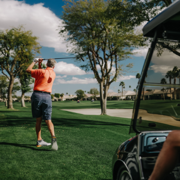 Man golfing on golf course