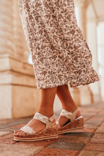 Woman standing on sidewalk