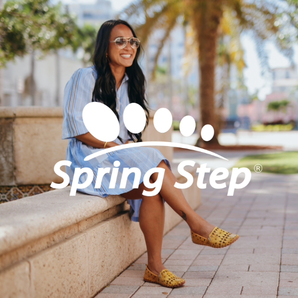Woman sitting next to water fountain 