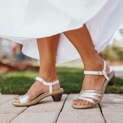 Woman standing on sidewalk