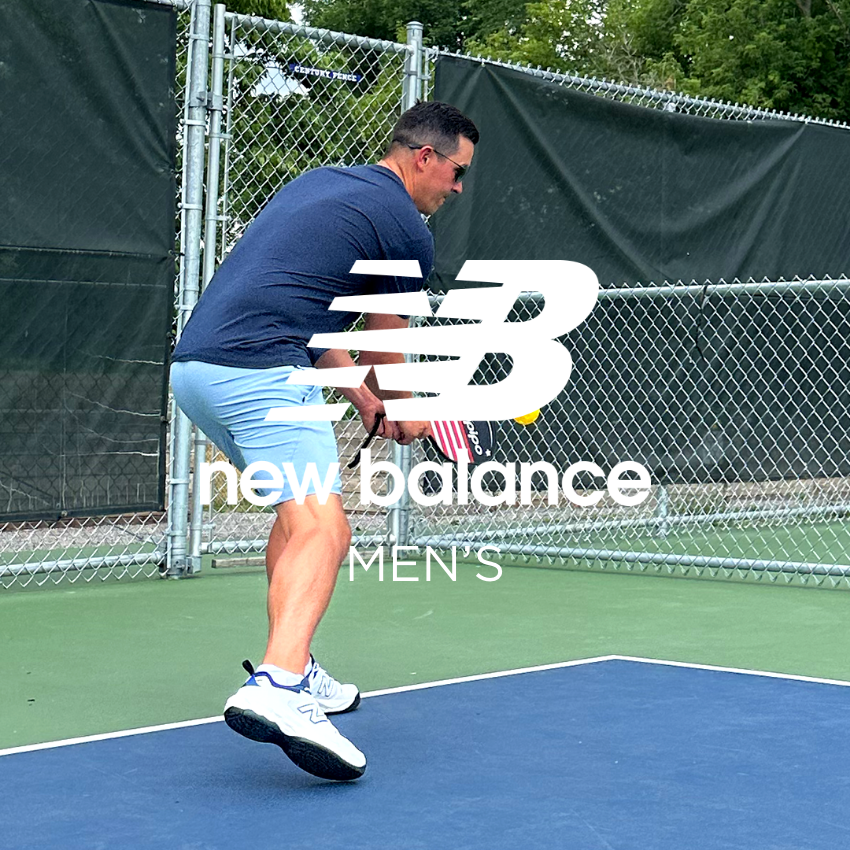 Man hitting pickleball on court