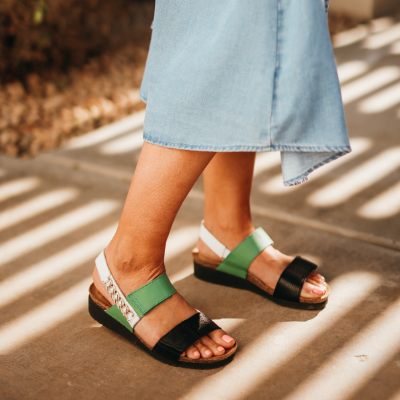 Woman standing on sidewalk