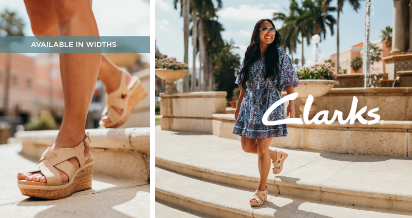 Woman walking down steps by outdoor fountain