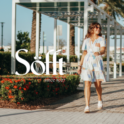 Woman walking through shopping plaza