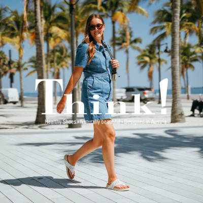 Woman walking through beach walkway