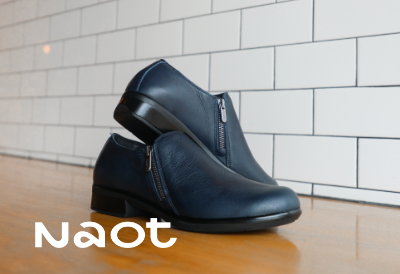 Naot Autan shoes sitting on coffee shop table 