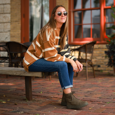 Woman sitting on park bench