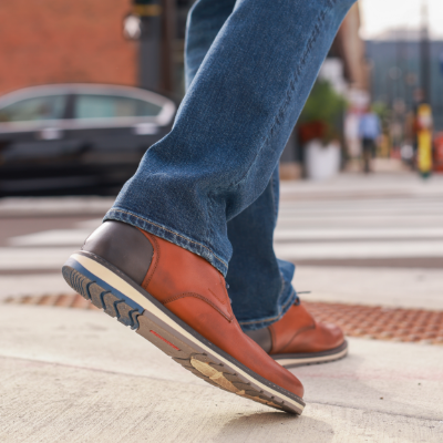 Man standing on sidewalk