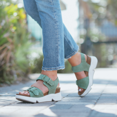 Woman standing on walking path 