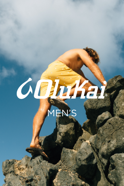 Man climbing up lava rock