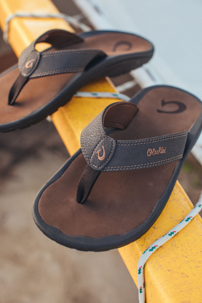Shoes sitting on surfboard