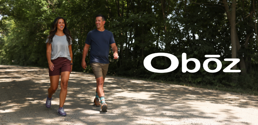 Man and woman walking on dirt road
