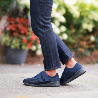 Woman standing on sidewalk