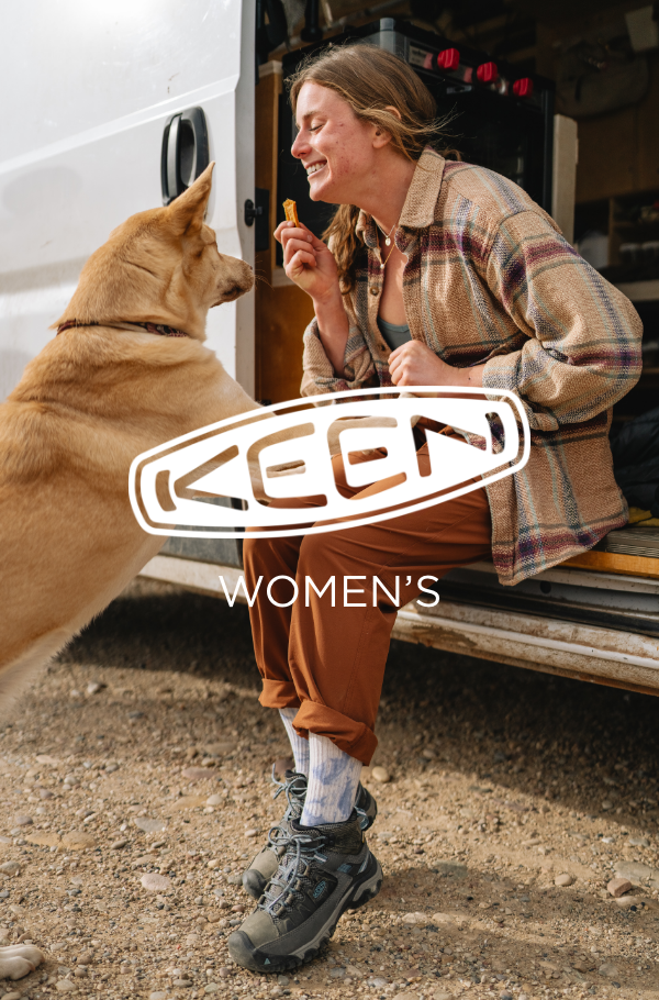 Woman playing with dog outside