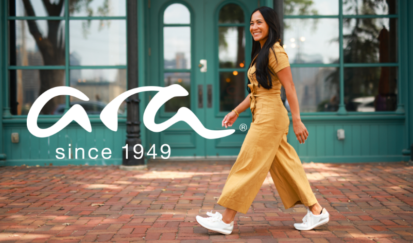 Woman walking down sidewalk 