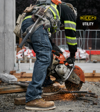 Man working outside with construction equipment wearing Keen Utility