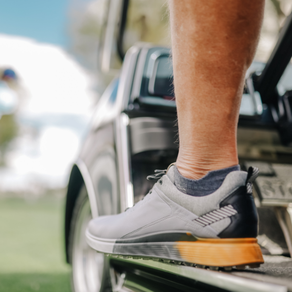 Man waiting on golf cart