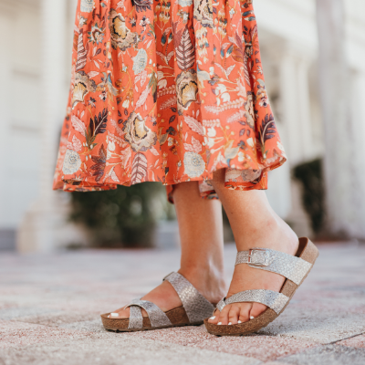 Woman standing on sidewalk