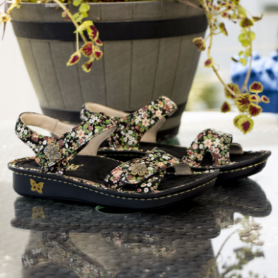 Shoes sitting on picnic table