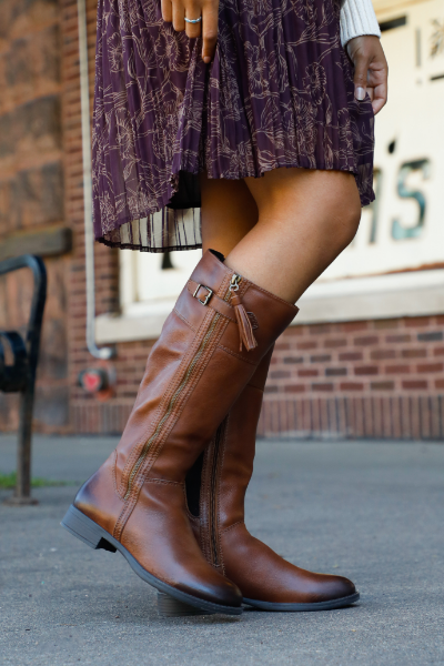 Woman standing on sidewalk