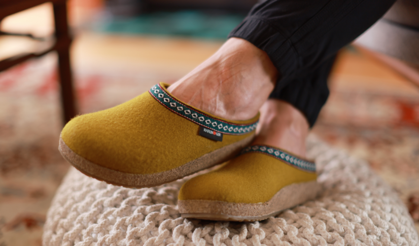 Woman resting feet on ottoman 