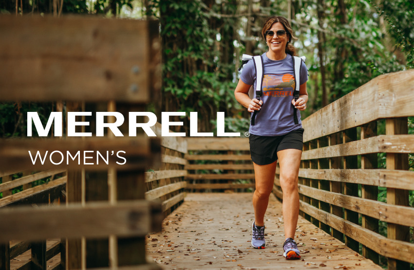 Woman walking on bridge in park