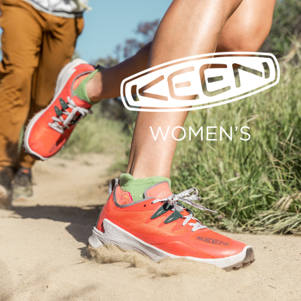 Woman running through dirt and sand
