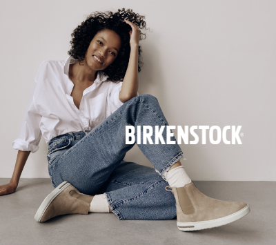 Woman posing on studio floor in Birkenstock Bend Chelsea Boots
