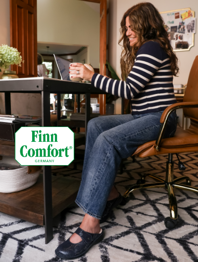 Woman working in home office in Finn Comfort Standford mary-janes