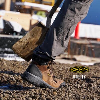 Man walking through slush in Keen Utility