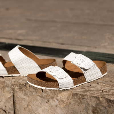 Shoes sitting on sidewalk