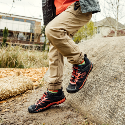 Kid running down rock