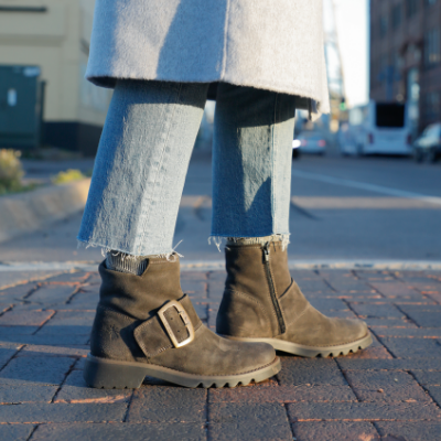 Woman standing on sidewalk