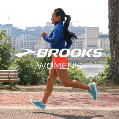 Woman running on sidewalk