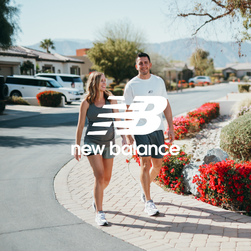 Man and woman walking on sidewalk