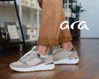 Woman shopping in Modern Roots wearing Ara Gardenia sneakers