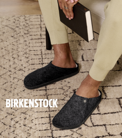 Man sitting in chair wearing Birkenstock Zermatt Shearling slippers
