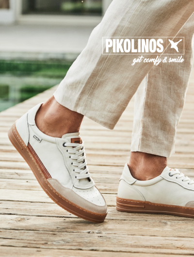 Man standing on dock wearing Pikolinos sneakers