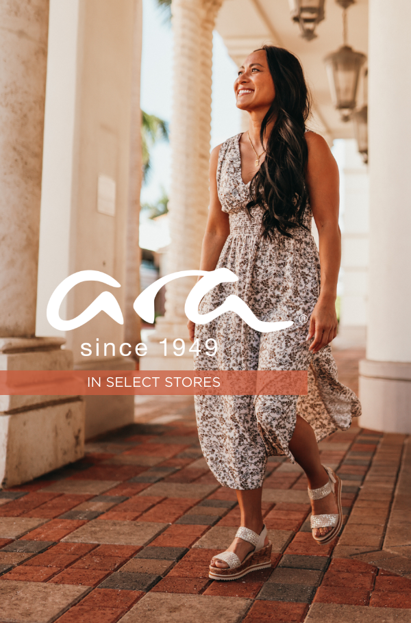 Woman walking through outdoor shopping mall