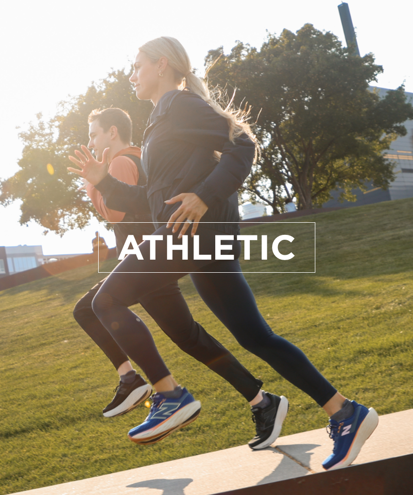 Man and woman running in New Balance shoes