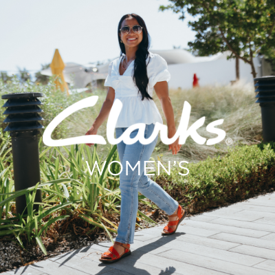 Woman walking on sidewalk
