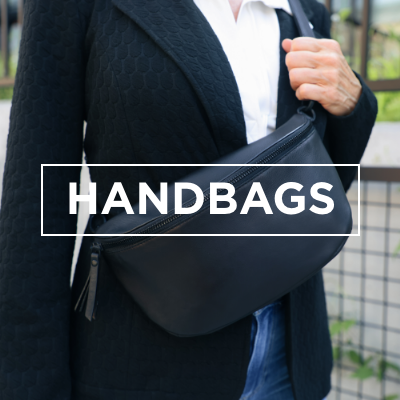 Woman holding onto Milo handbag